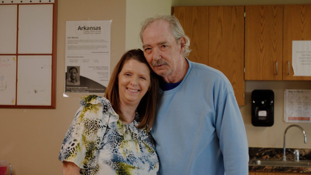 A nurse hugs a man using the respite care service at Corning